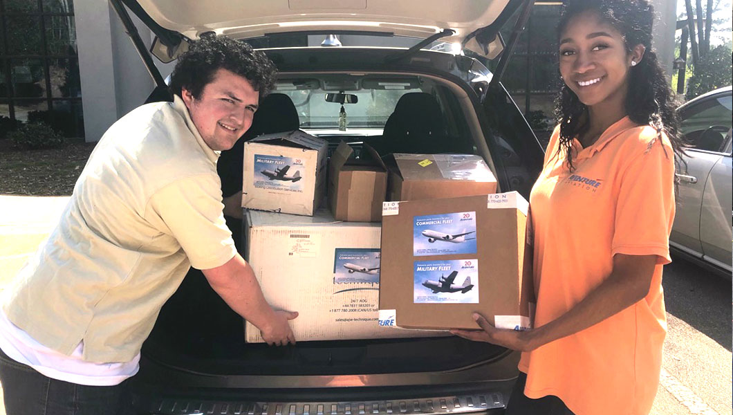 Aventure Aviation | Aventure staff loads supplies in car headed for Piedmont Hospital