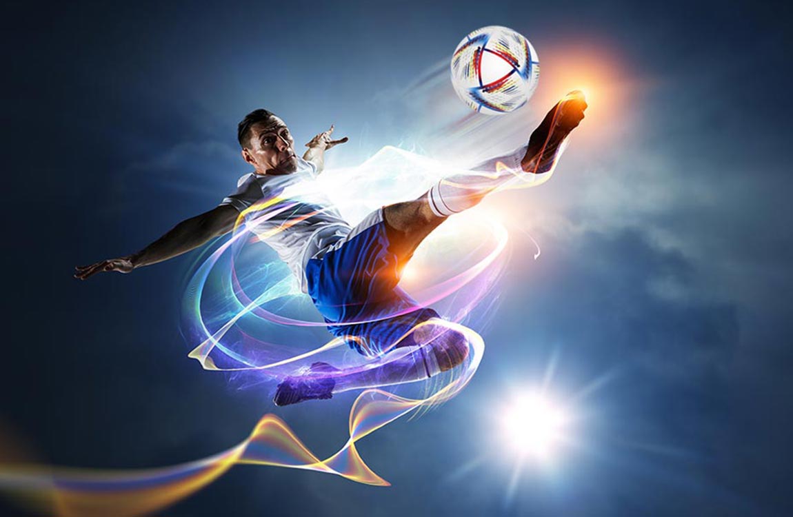 Soccer player kicks ball high into the night sky 