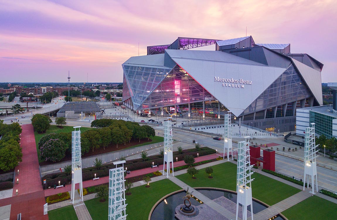 View of Mercedes-Benz Stadium with a beautiful purple sky 