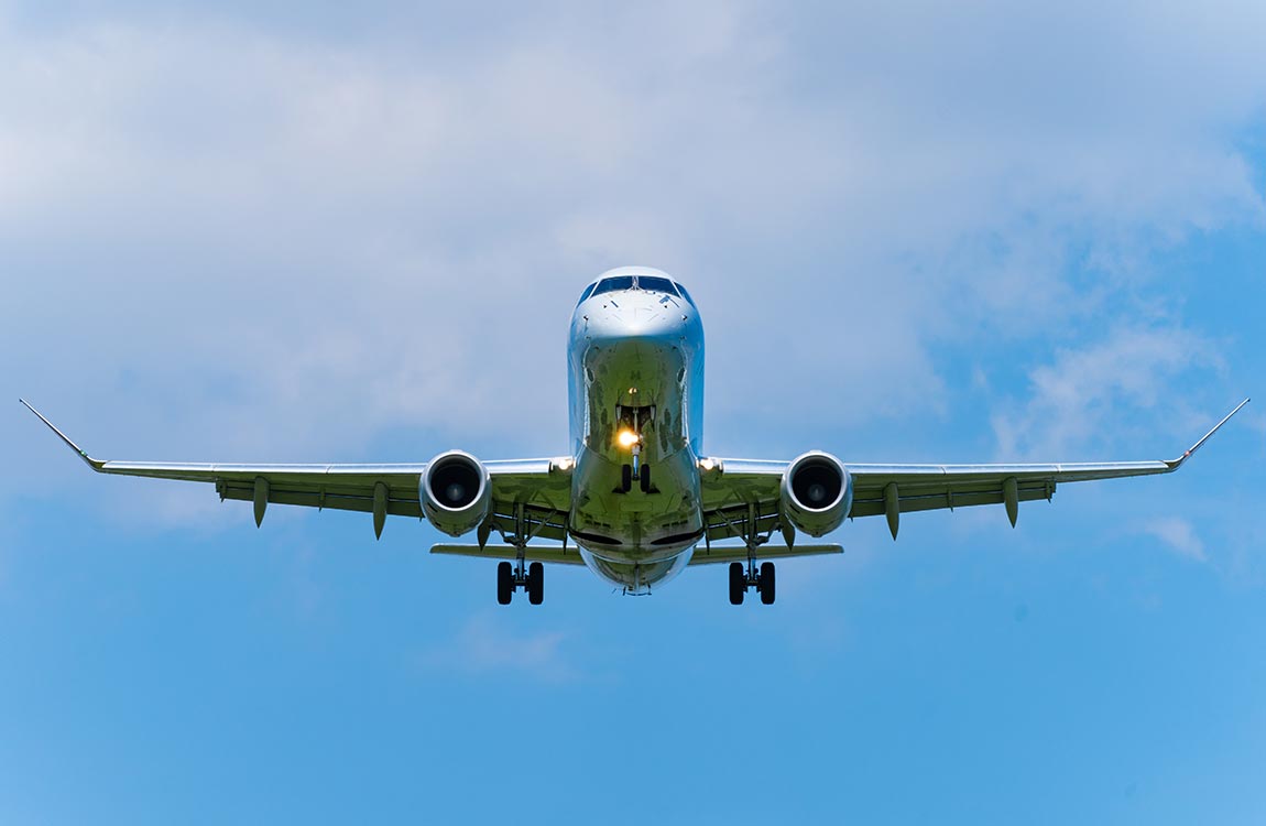 Jet aircraft in flight with blue sky 