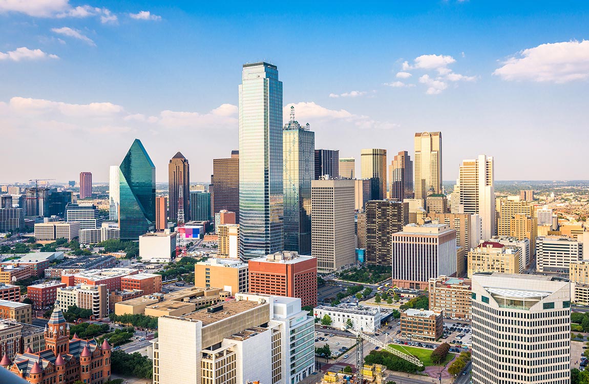  Dallas skyline with skyscrapers under a blue sky with clouds 