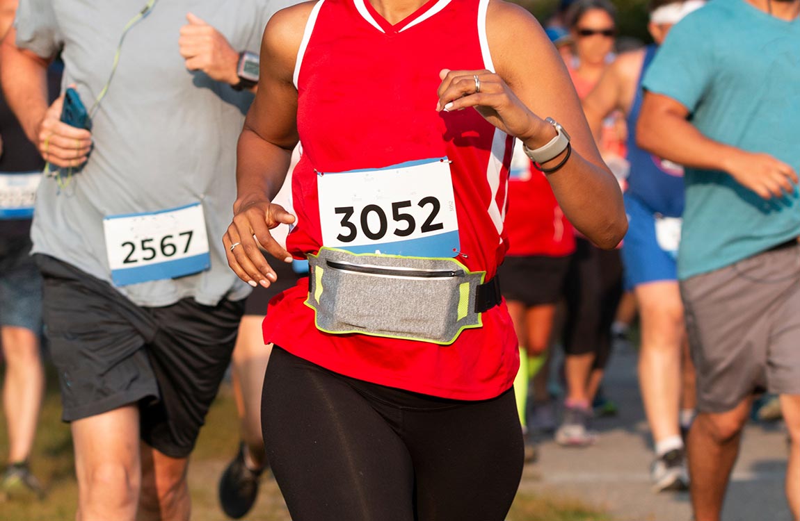 Close up of three marathon runners heading towards the camera  