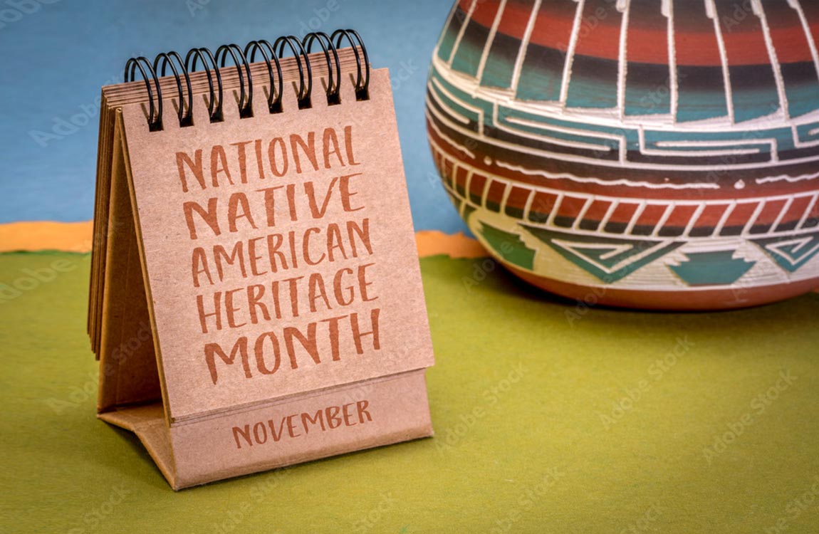 Rolodex saying "Native American History Month –November" in front of colorful Native American pottery 