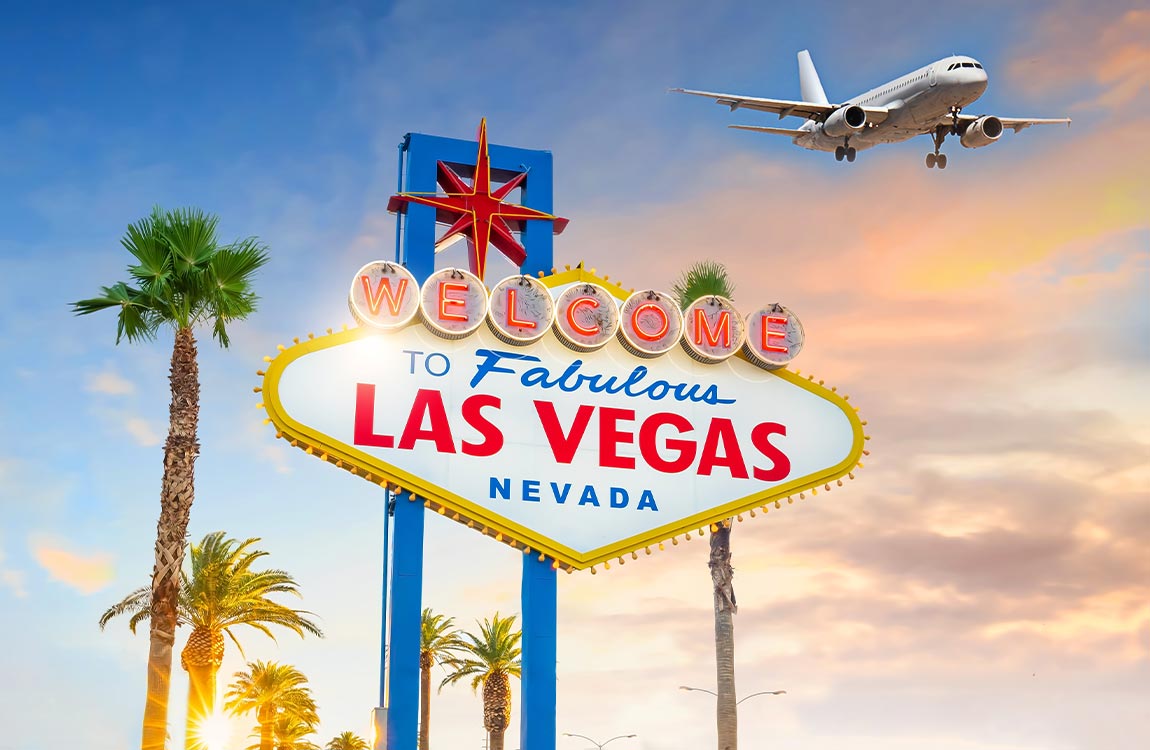 A close up of the famous "Welcome to Fabulous Las Vegas Nevada" sign, while an  airplane prepares for landing above it in the sky 
